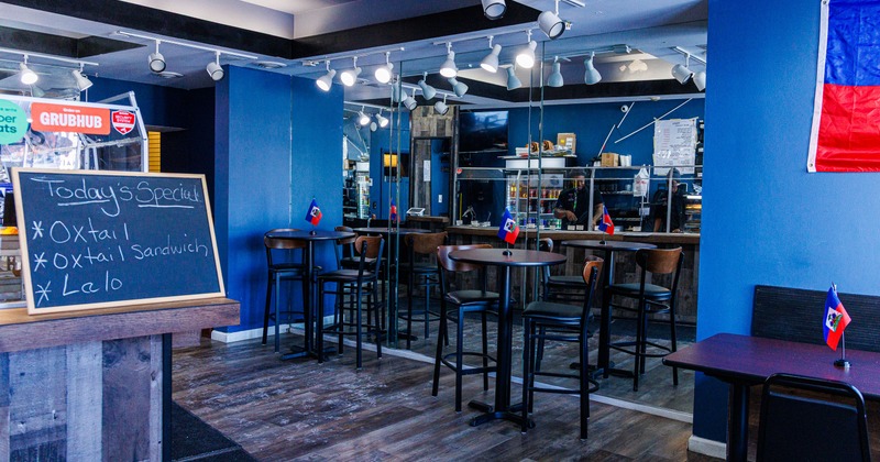 Bar area, mirror wall, bar tables, stools