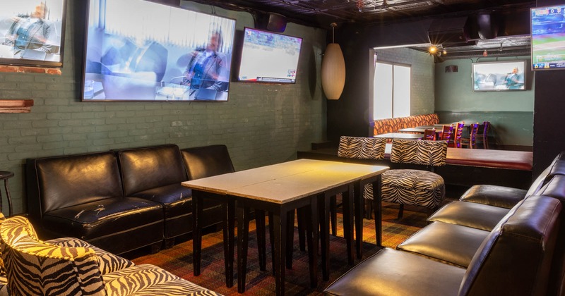 Interior, seating area, TVs on the wall