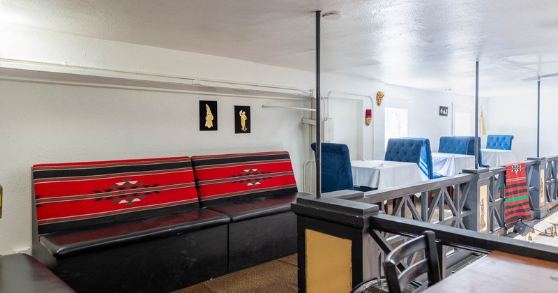 Interior, long seating bench and tables on the upstairs