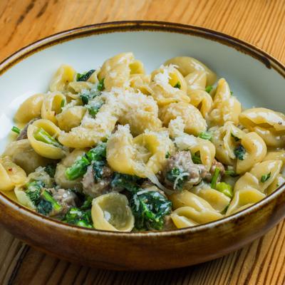 Orecchiette pasta with Italian sausage, broccoli rabe, and spicy chili flakes.