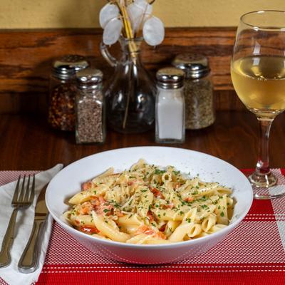 Penne with Vodka Sauce, served with white wine.