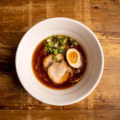 Shoyu Ramen, in brown broth, with pork, noodles, egg and green onions
