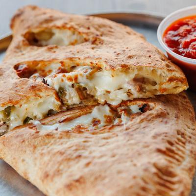 House Special Calzone sloced in half, close-up.