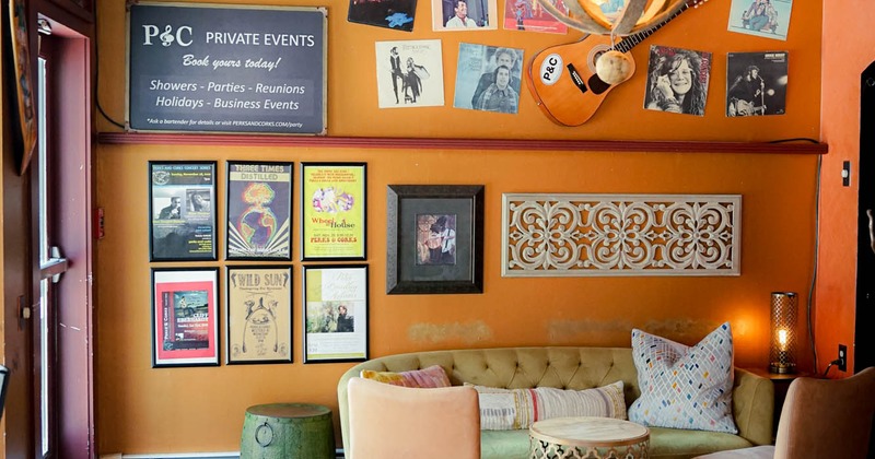 Interior, sofa, tables and chairs, posters on the wall