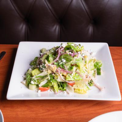Greek Salad with onions, cucumbers, tomatoes, feta cheese, olives and artichokes.