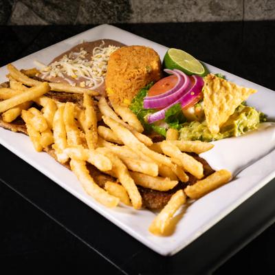Breaded steak with guacamole, sour cream, salad, fries, rice, and refried beans.