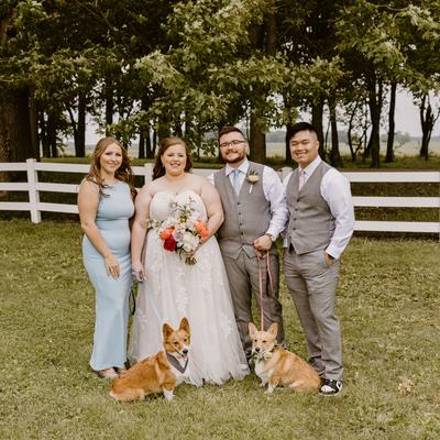 Wedding couple with best man and maid of honor and their two dogs.