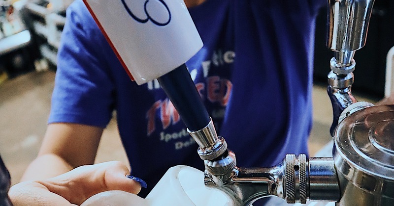 Bartender pouring beer from the tap
