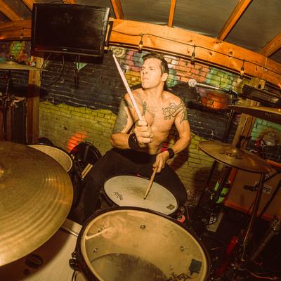 A drummer playing on stage