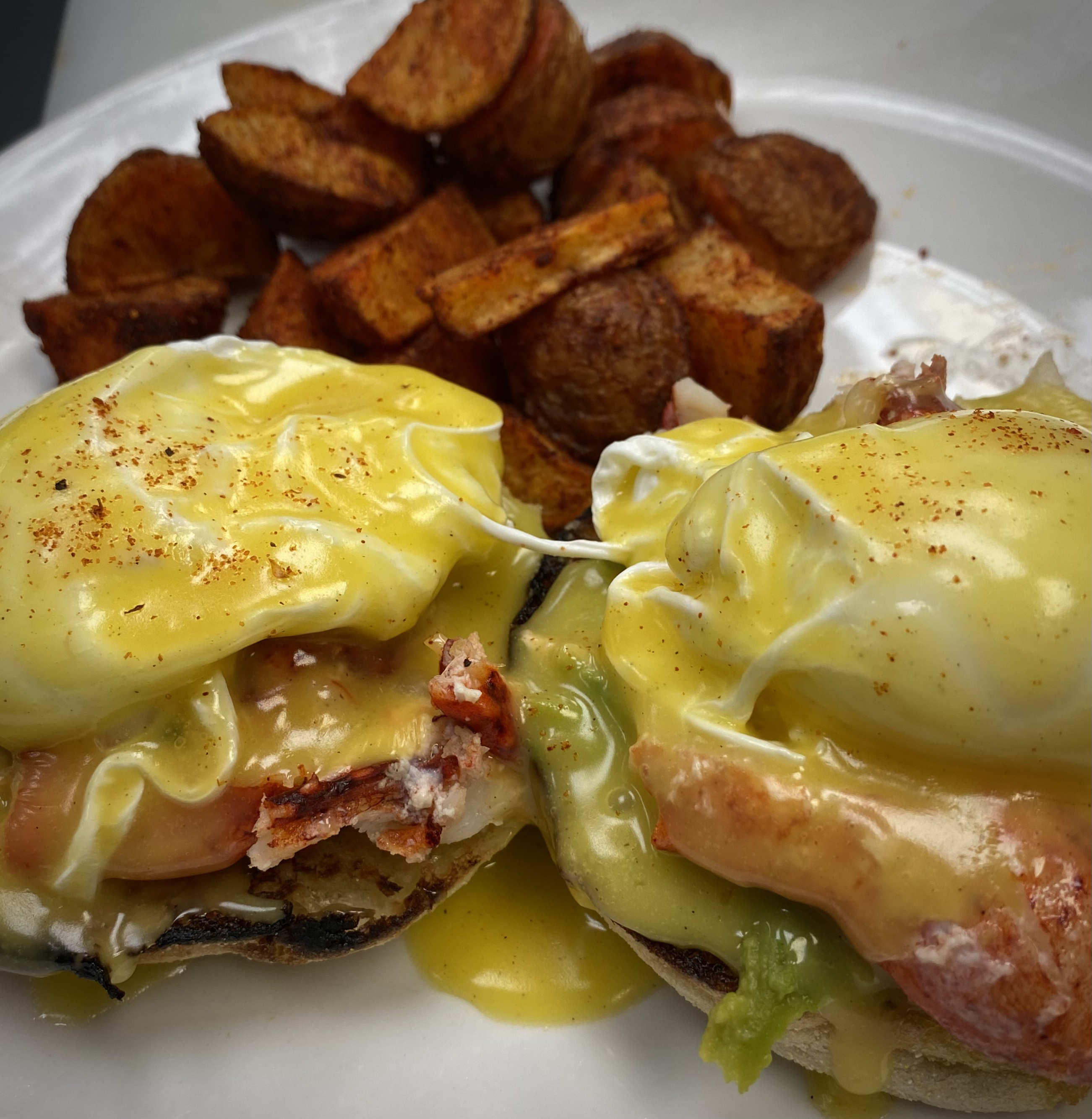 A picture of our lobster benedict with home fries.