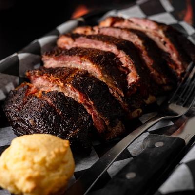 Half rack of ribs and a corn muffin.