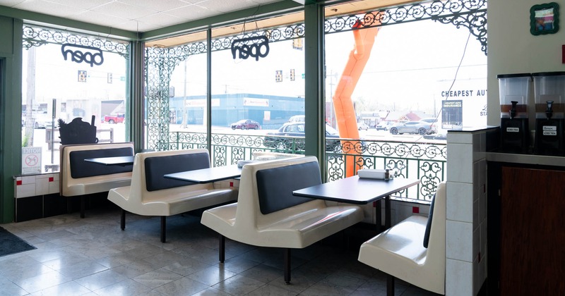 Interior, booths with tables near the windows