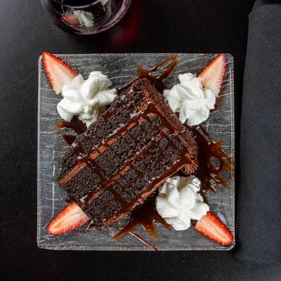 Sinfully chocolate cake, served with strawberries and cream.