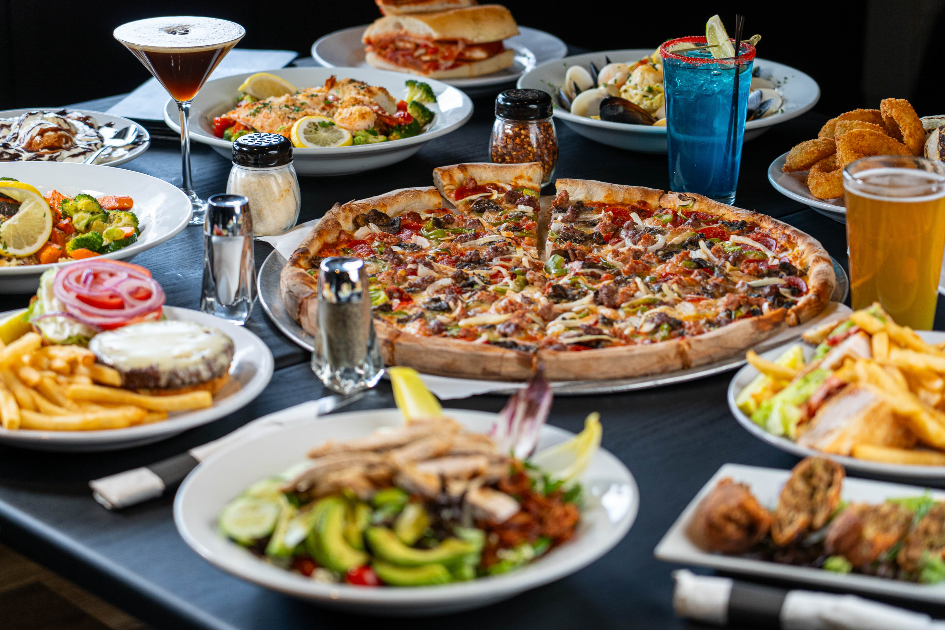 Assortiment of meals served on the table wuth drinks