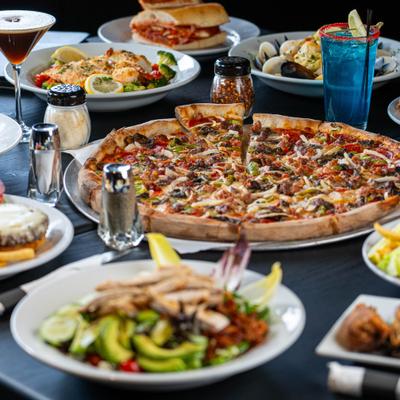 Assortiment of meals served on the table wuth drinks.