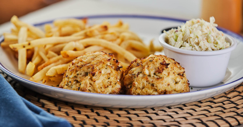 Fries, meatballs and salad on the side