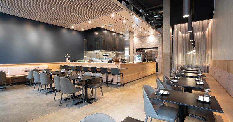 Interior, main seating area with sushi bar at back