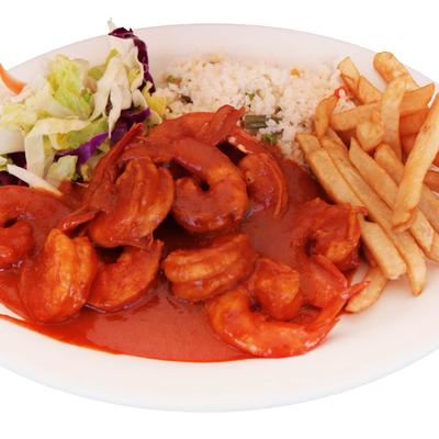 Camarones a la Diabla with sides of rice, fries and a salad.