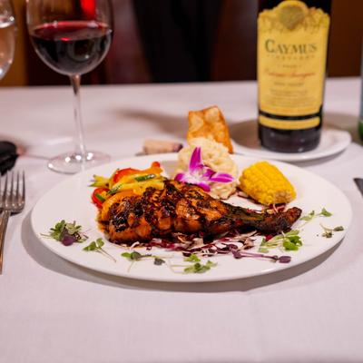 Char-grilled filet of salmon served with red wine.
