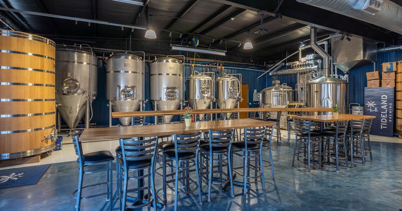 Interior, bar stools and tables, beer tanks in the back