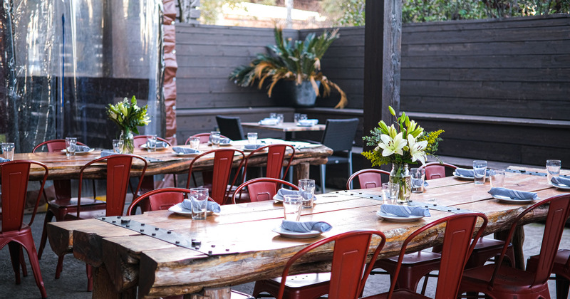 Exterior, patio tables set with tableware