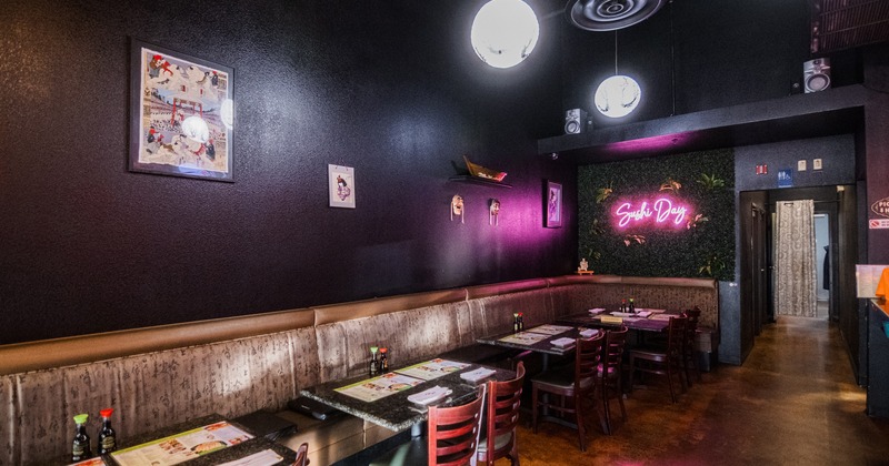 Sushi restaurant interior space, lined up tables