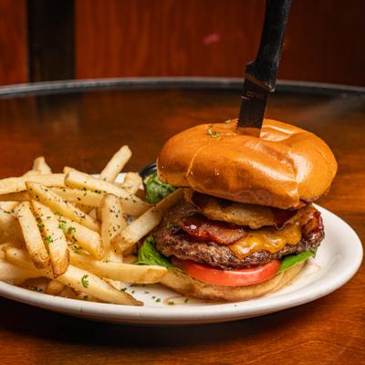 Bacon cheeseburger, with onion rings and fries.