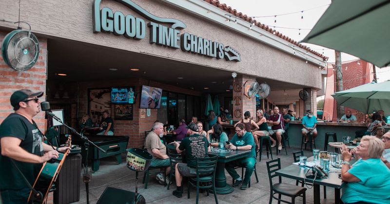 Exterior, musician performing for guests