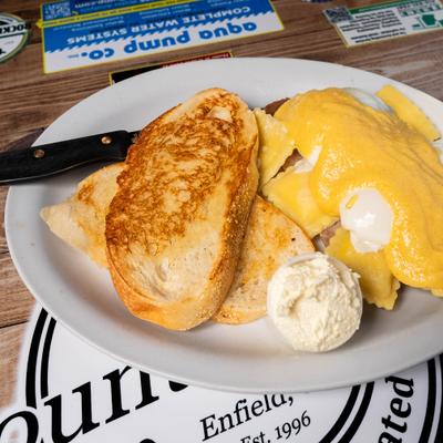 Ravioli Benedict, toast, and garlic hollandaise.