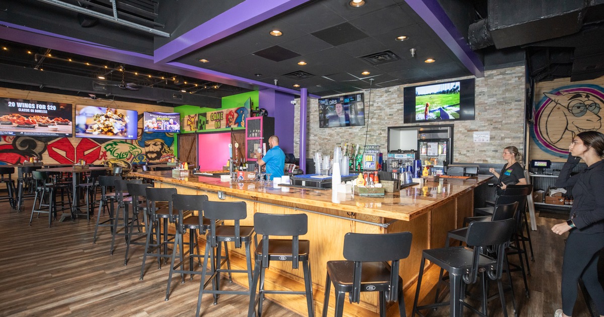 Bar, chairs, screens above