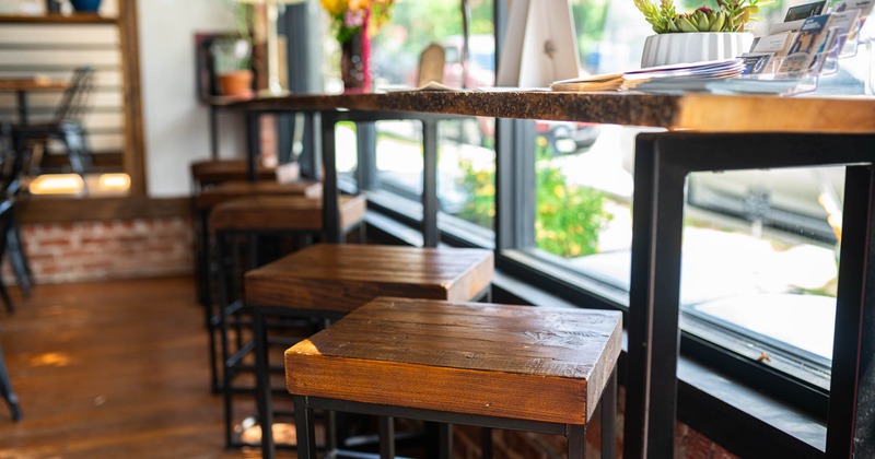Interior, seating by the window with stools