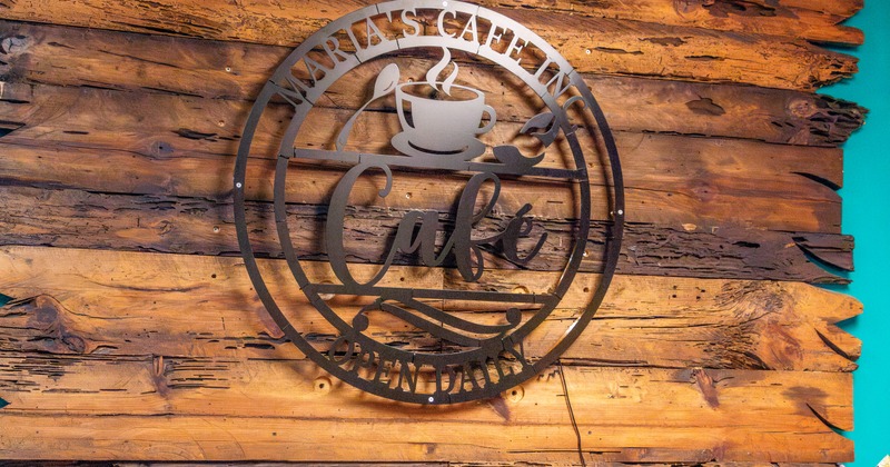 Sign on the wall made of cut metal plate