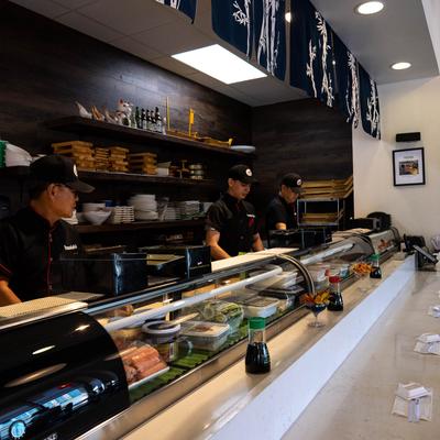 The serving counter and full shelves behind it.