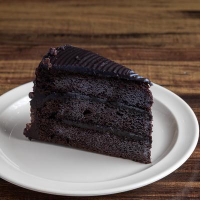 Chocolate Layer Cake served on a white plate.