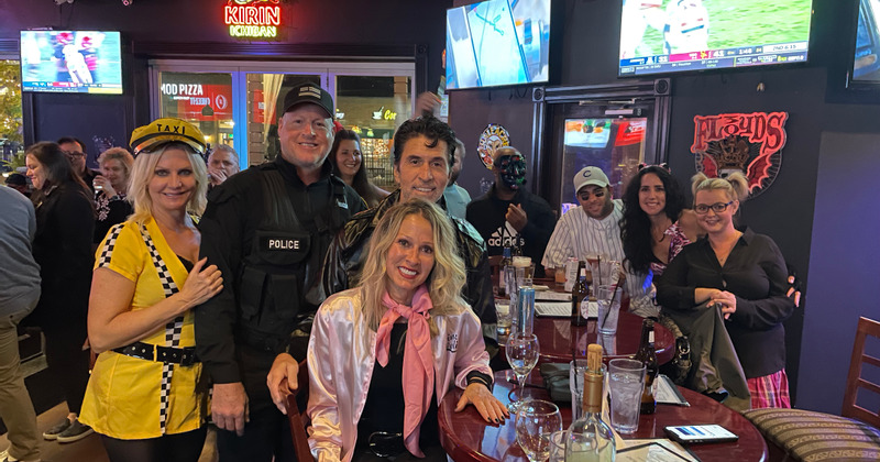 Interior, guests and staff posing for the photo