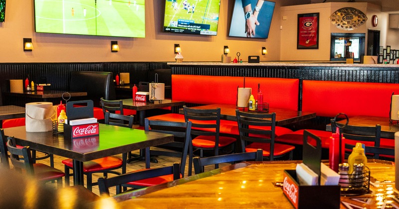 Interior, tables, chairs, TVs on the wall