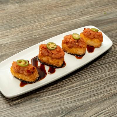 Crispy rice, spicy tuna, sliced peppers, and eel sauce.