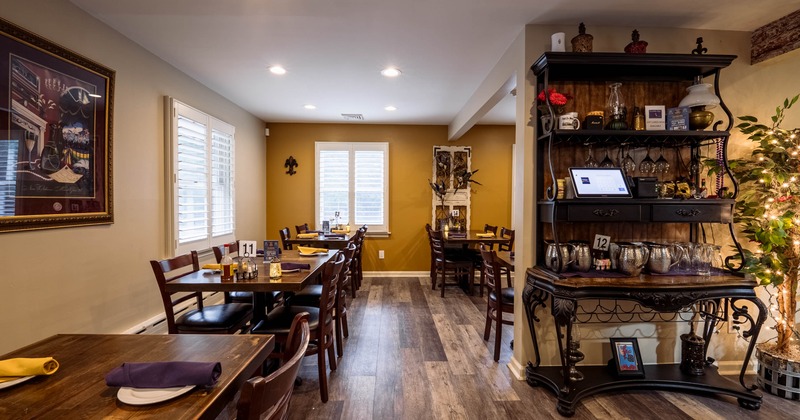 Interior, dining area, tables for four, waiter serving station, windows with blinds