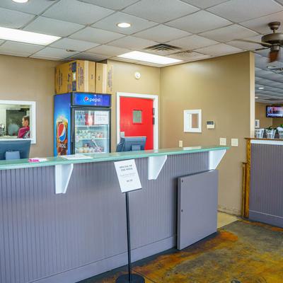 Interior with a service counter and a refrigerator.