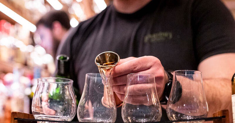 Bartender pouring drinks, closeup