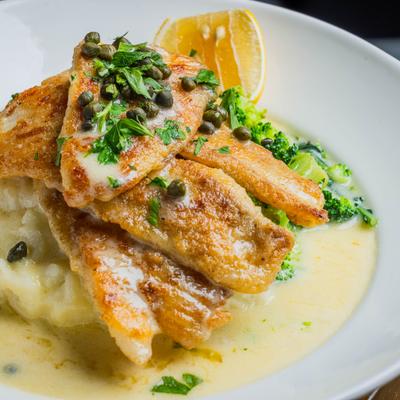 Petrole sole plated with capers and lemon sauce.