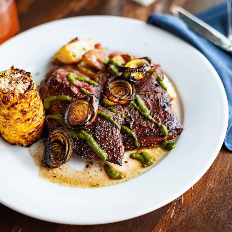 Carne asada skirt steak, chimichurri sauce, oven fired leeks, corn-cob, roasted potatoes - GF photo