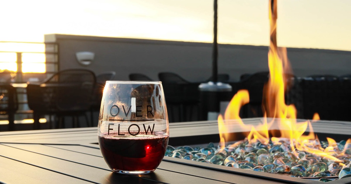 Glass of red wine served on a fire pit table