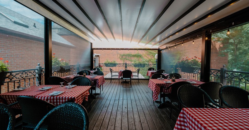 Covered patio with chairs and tables