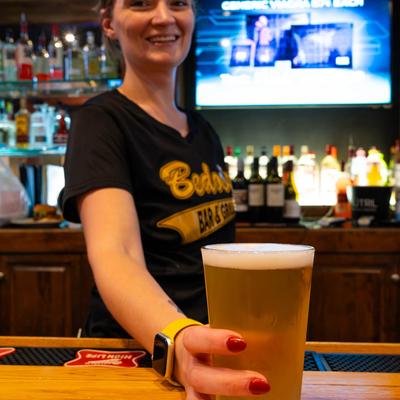 Bartender serving beer.