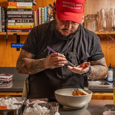 Chef plating a gourmet dish.