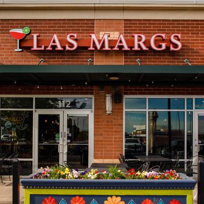 Exterior, front entrance, colorful planter.