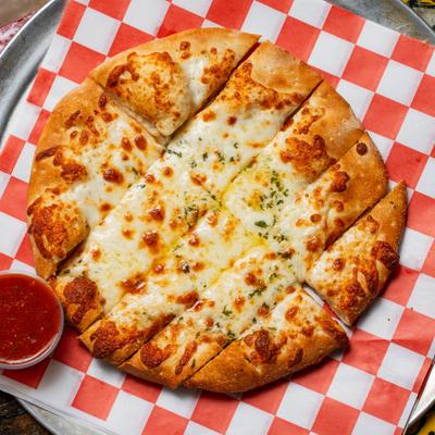 Cheese pizza and marinara sauce, top view.