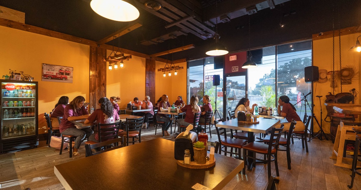 Interior, wide view, dining area, guests sitting