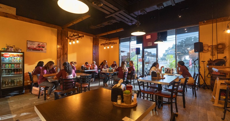 Interior, wide view, dining area, guests sitting